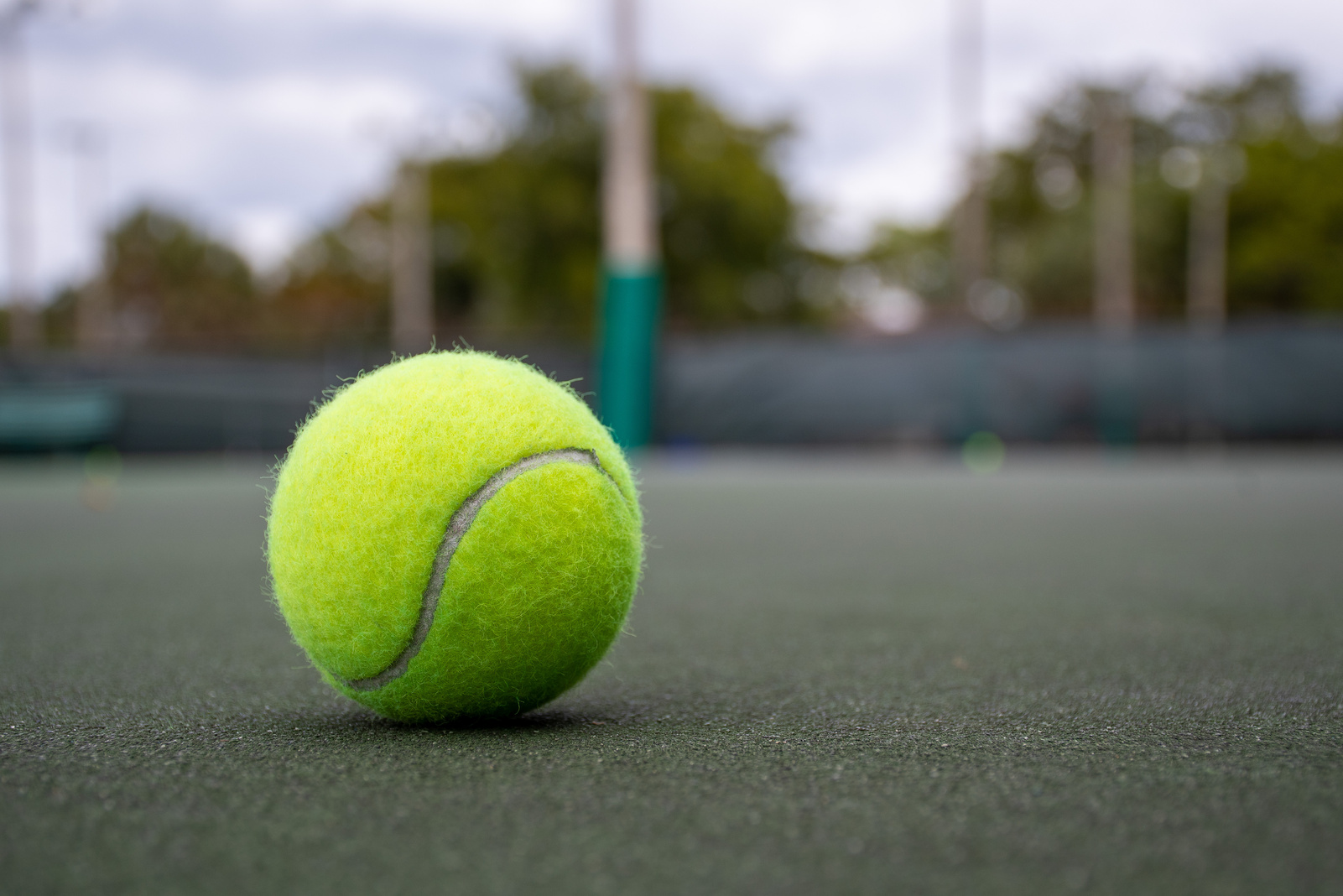 Green Tennis Ball on a Tennis Court
